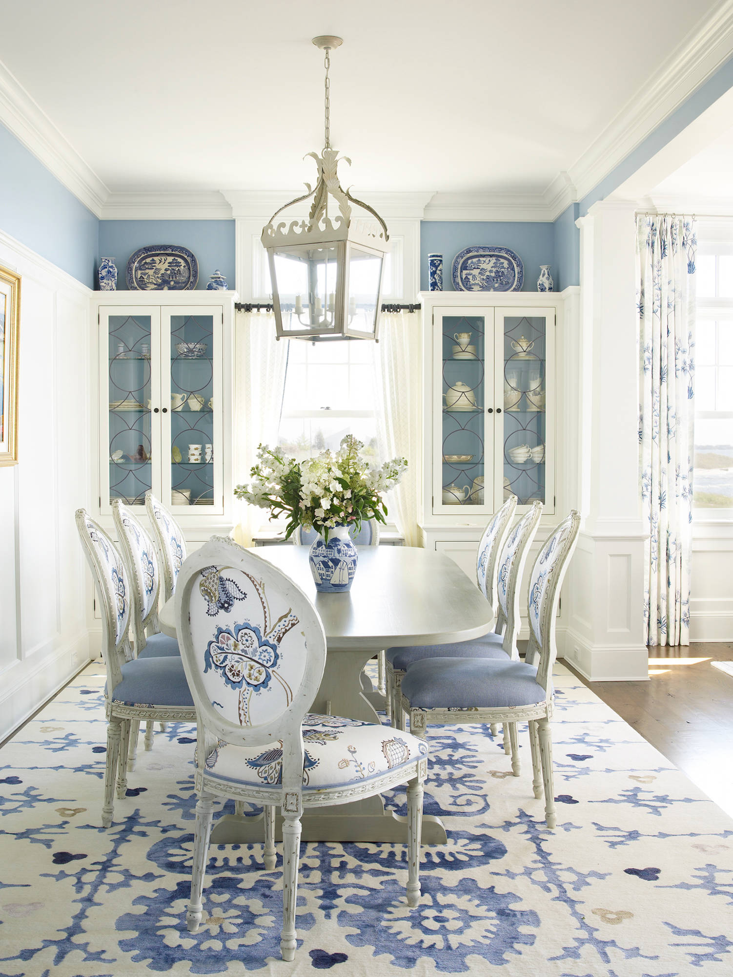 beach style dining room with color of white and blue decoration