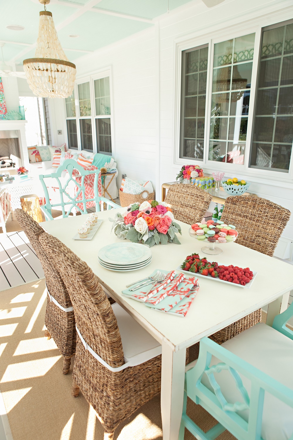 coral and aqua dining table on terrace