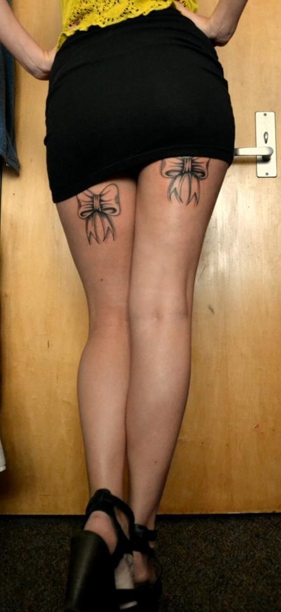 bow tattoo on thigh