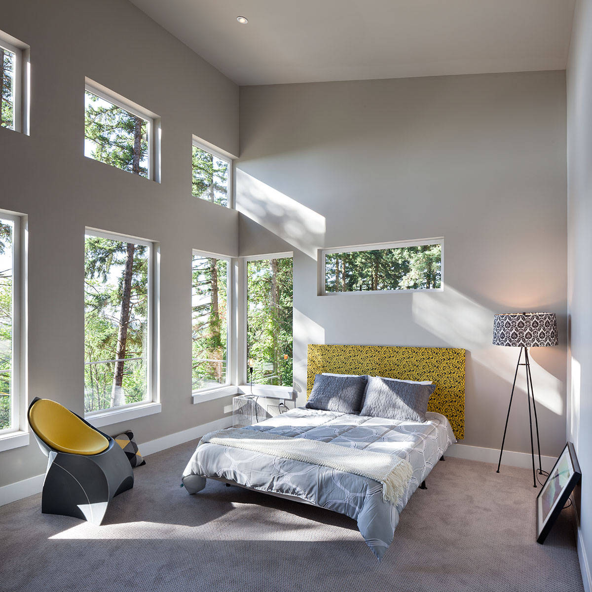 large contemporary master bedroom in Portland with gray walls, carpet